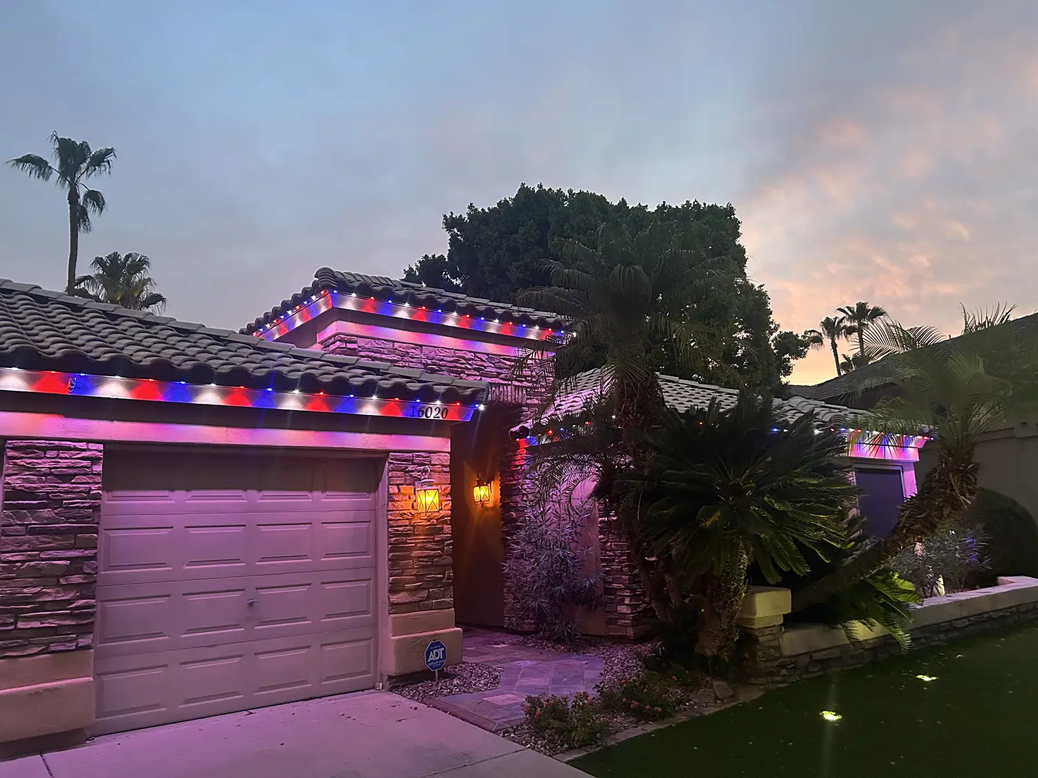 Permanent trim lighting installed on a Apache Junction, Arizona home at dusk