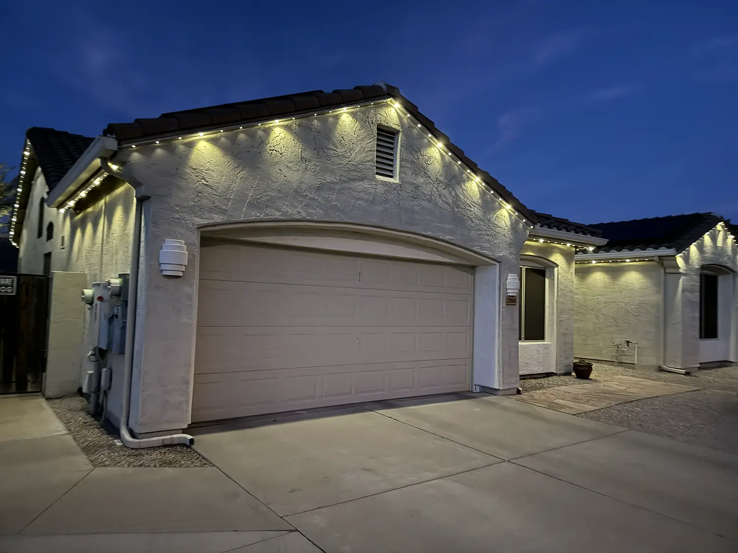 Permanent trim lighting installed on a Carefree, Arizona home at dusk